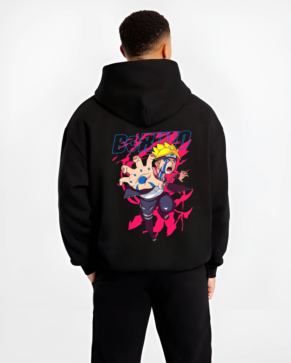 Black hoodie on male model, back view, featuring Boruto shonen battle graphic with blue Karma streaks and vivid neon pink aura.
