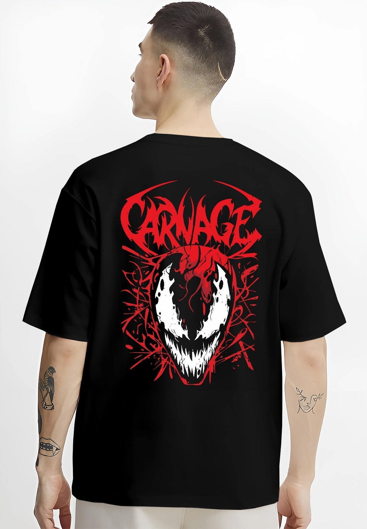 Black T-shirt on male model, back view, Carnage villain mask graphic with red symbiote tendrils and sharp graffiti lettering.