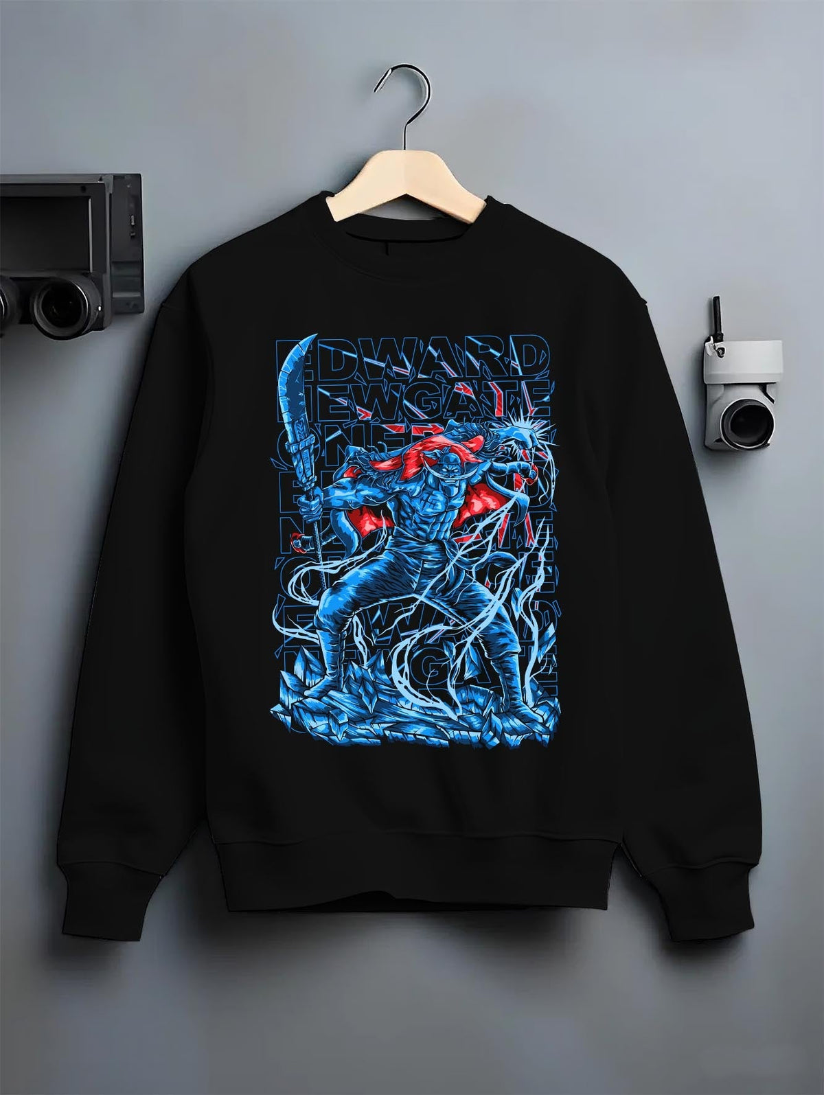 Black crewneck sweatshirt on hanger against grey wall, Edward Newgate retro manga back graphic with blue render and red cape.