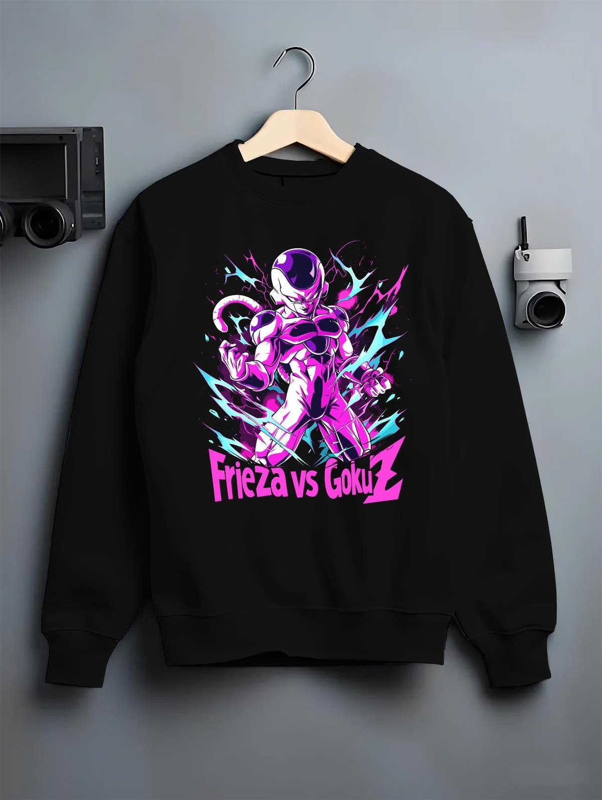 Black crewneck sweatshirt on a hanger against a grey wall, featuring Frieza Dragon Ball Z retro anime streetwear graphic with glowing purple aura and bold design.