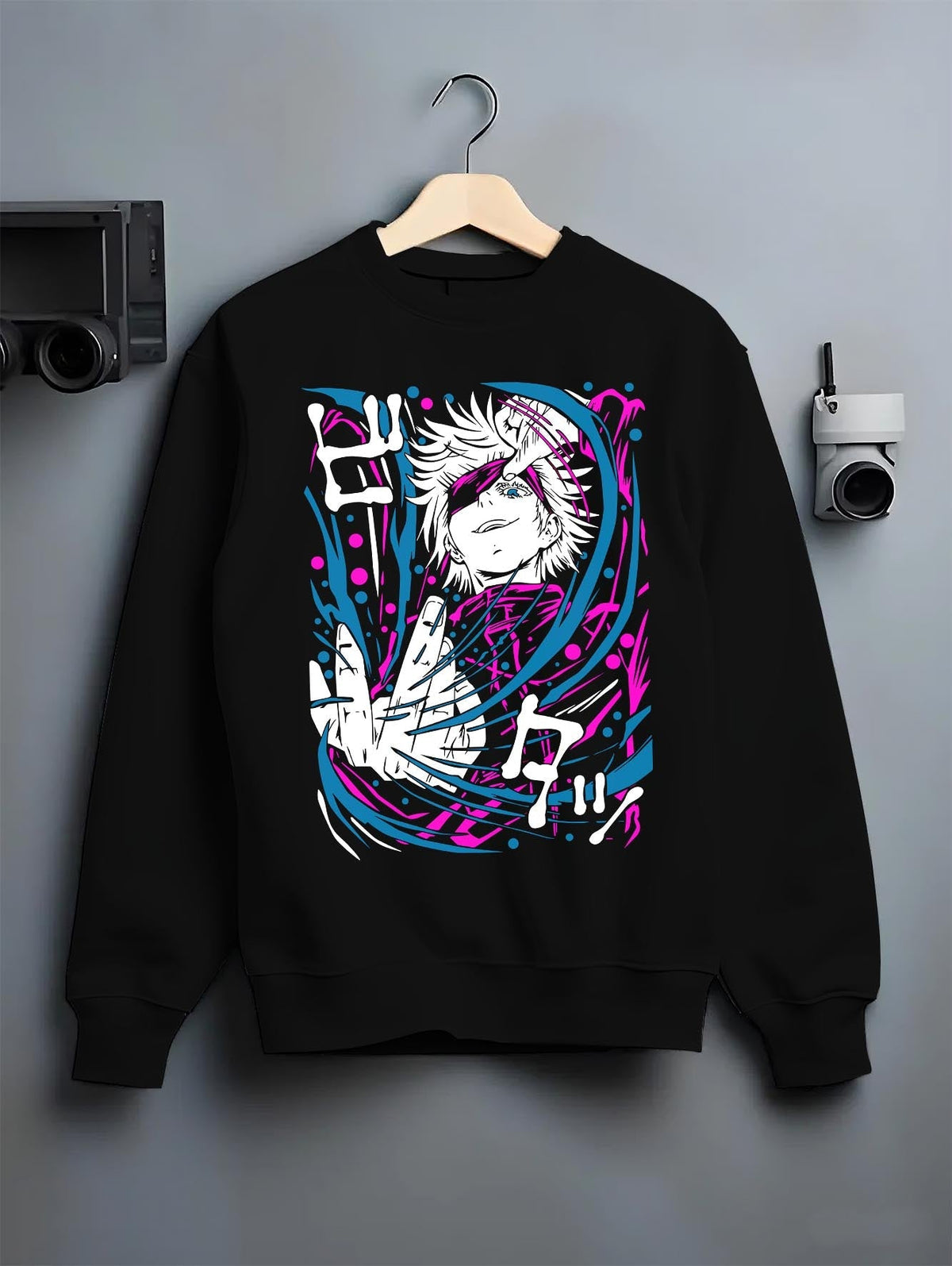 Black crewneck sweatshirt on hanger against grey wall, Gojo anime poster back graphic with bright pink and cyan swirls.
