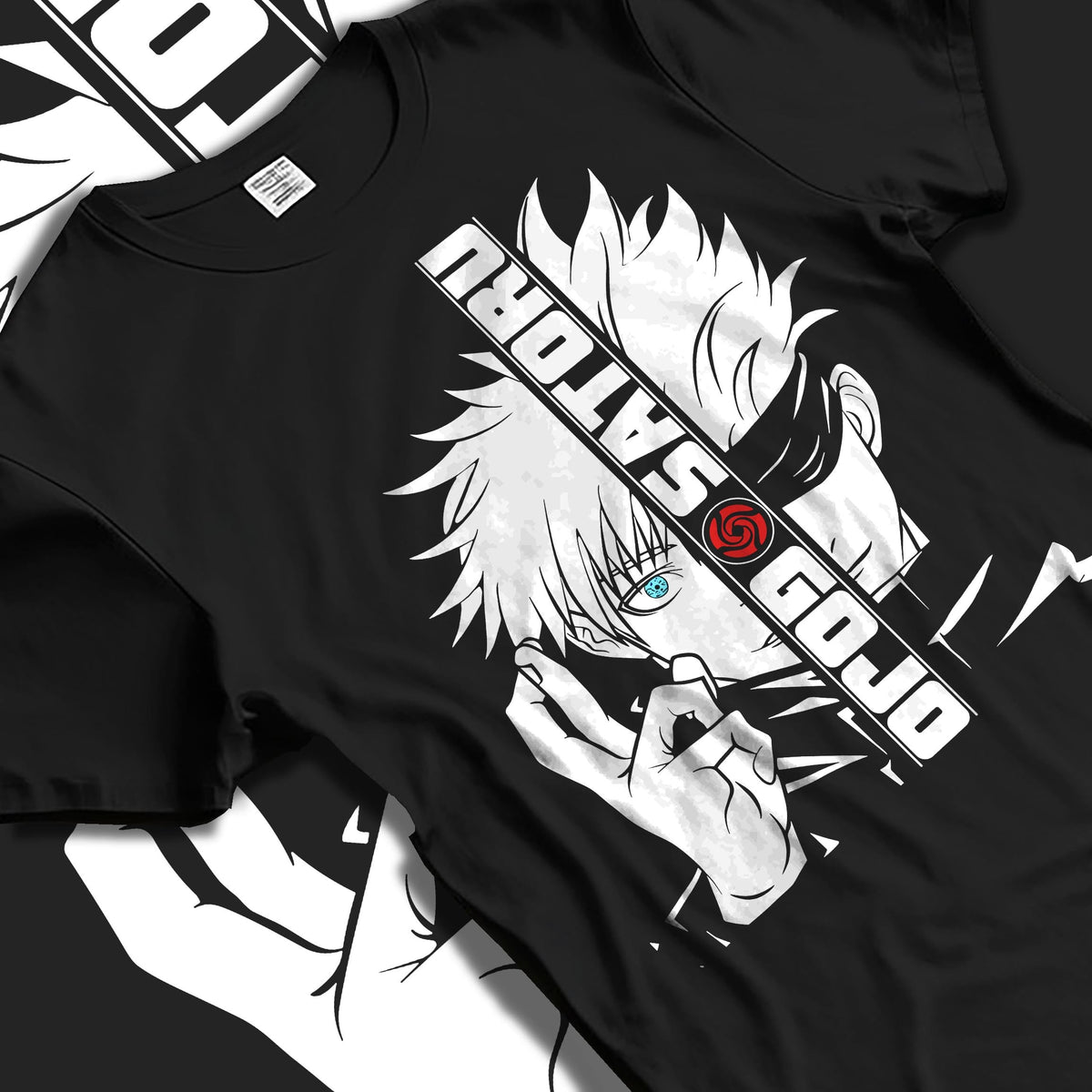 Black T-shirt laid flat with natural folds, featuring Gojo Satoru split portrait retro manga graphic and sharp vertical text motif.
