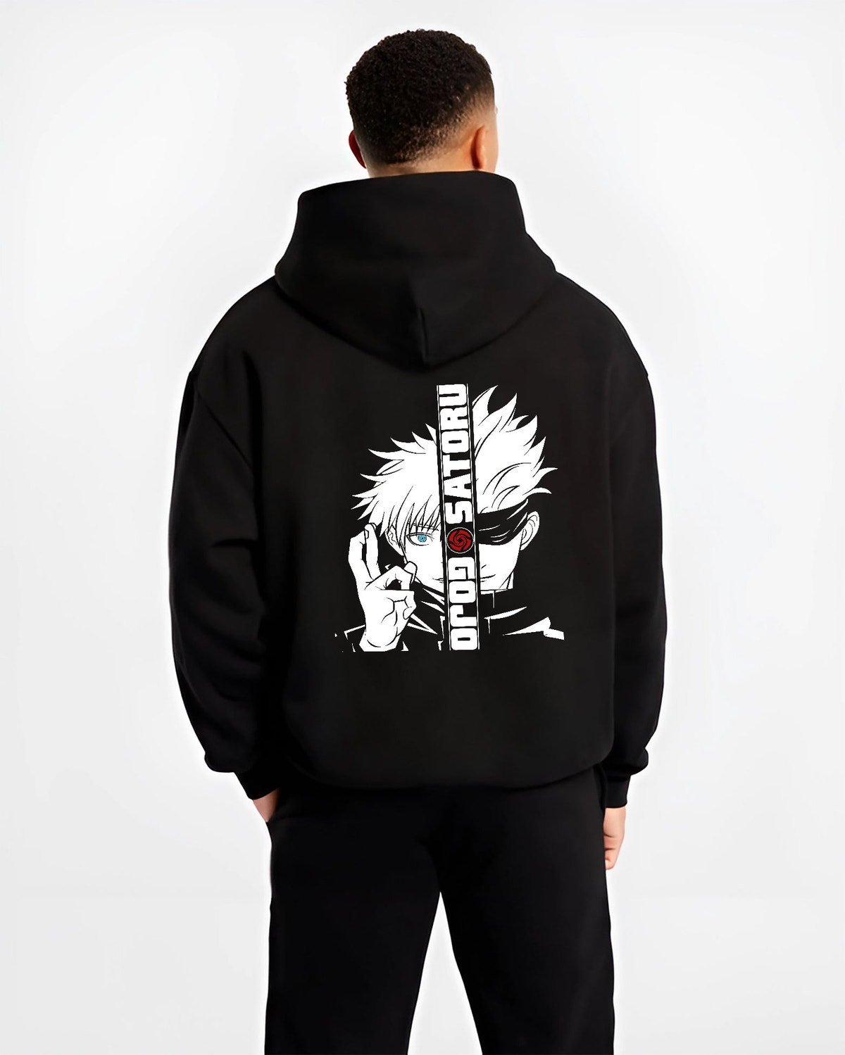 Black hoodie on male model, back view, featuring Gojo Satoru split portrait retro manga graphic with blue eye and urban streetwear flair.