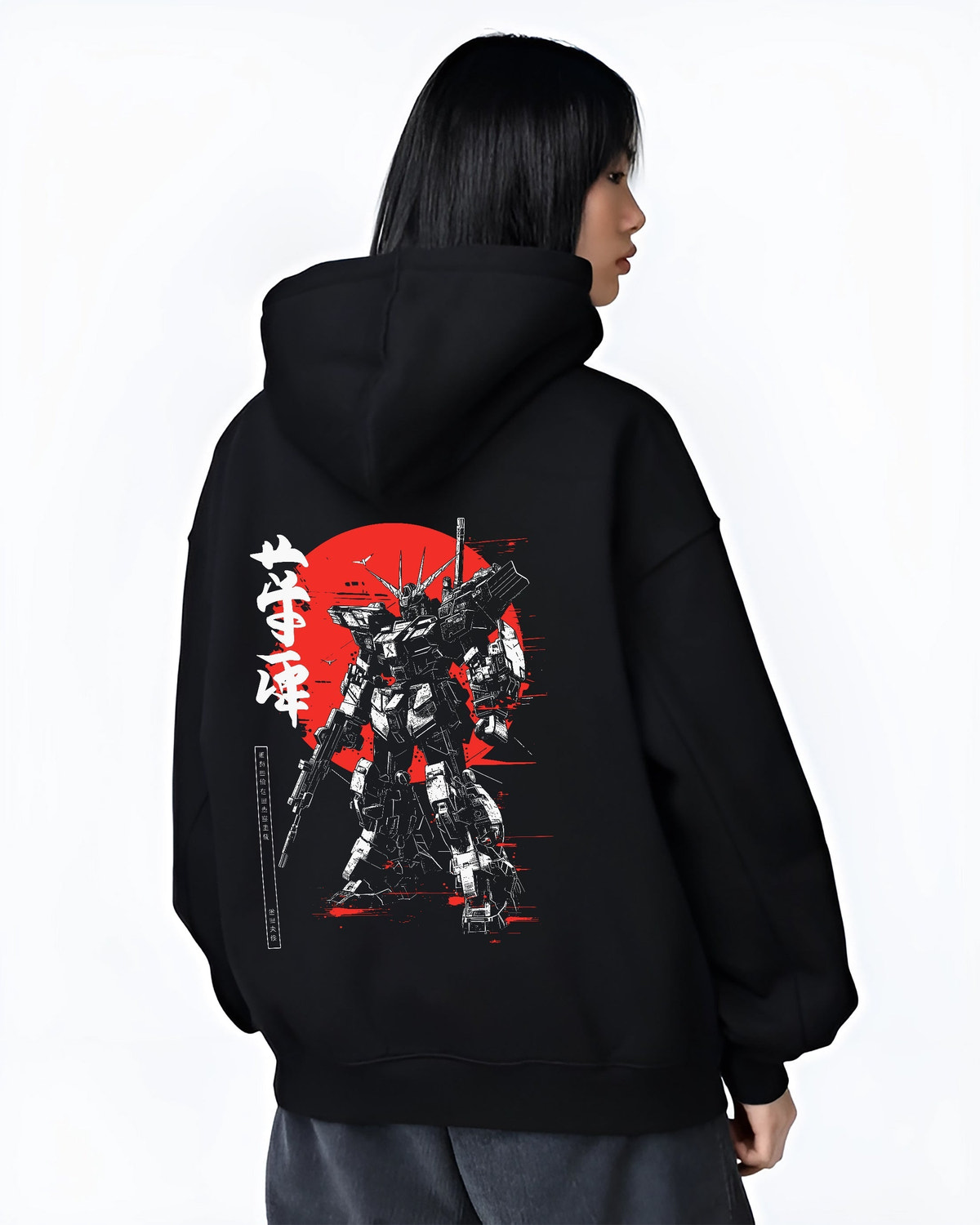 Black hoodie worn by a female model, back view, featuring Gundam anime poster inspired mecha artwork with striking black, white, and red tones in modern streetwear style.