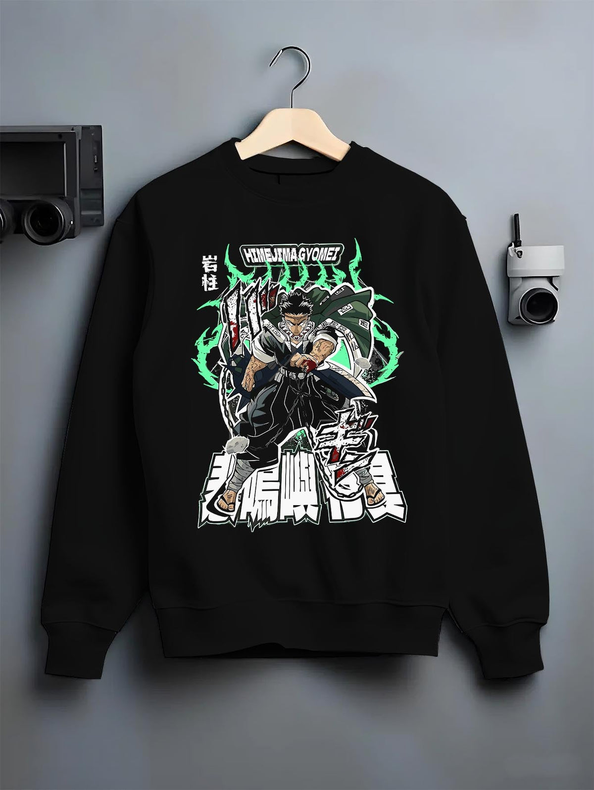 Black crewneck sweatshirt on a hanger against a grey wall, featuring Himejima Demon Slayer retro streetwear graphic with shonen battle character and glowing manga aura.
