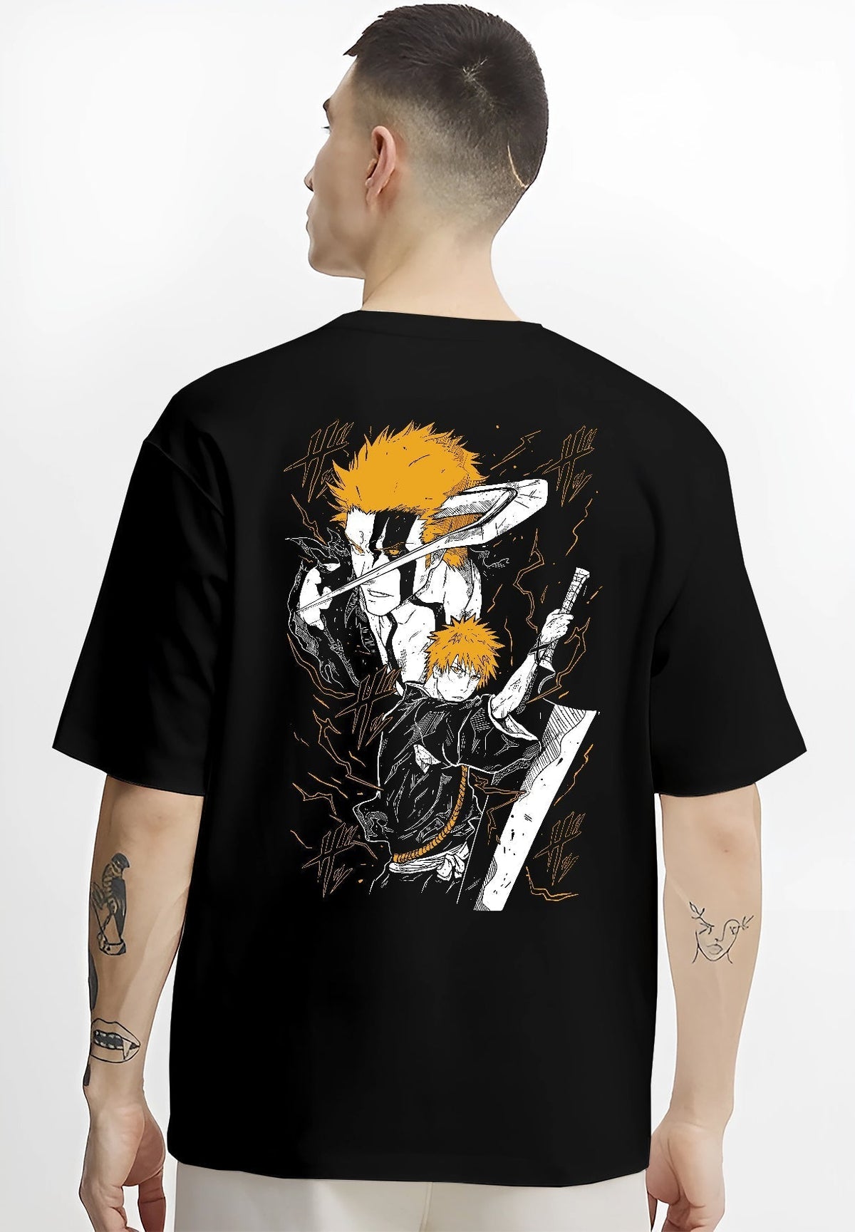 Black T-shirt worn by a male model, back view, featuring Ichigo Bleach anime poster inspired shonen battle design with bold sword stance in manga panel style.