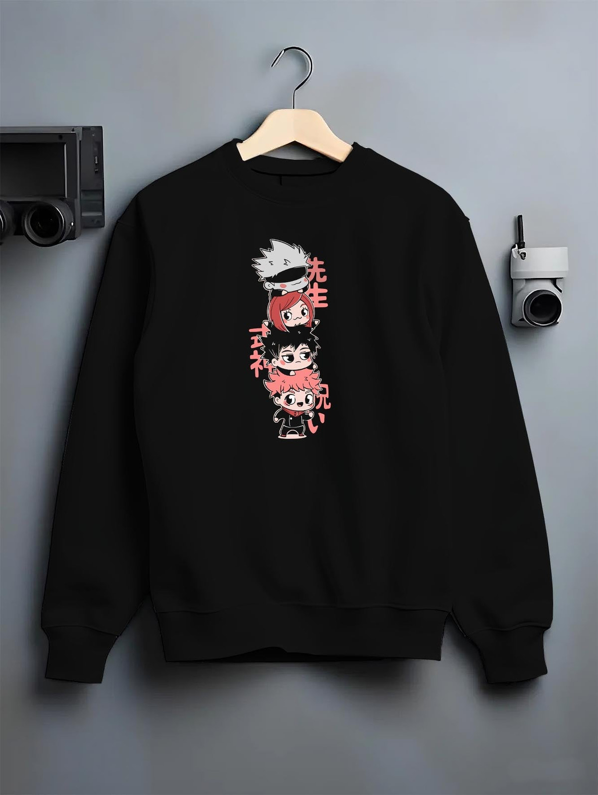 Black T-shirt on male model, back view, featuring Jujutsu Kaisen chibi stack design with retro manga vibes and pink kanji.