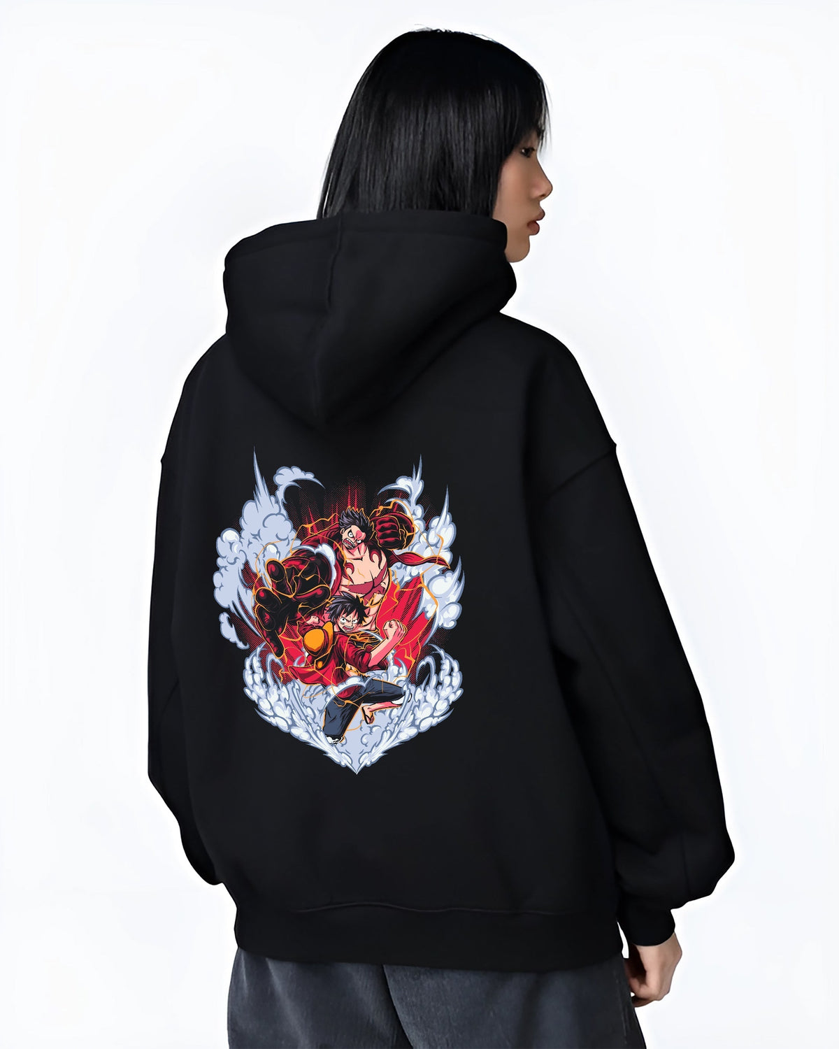 Black hoodie on female model, back view, One Piece Luffy Gear transformation fight artwork with swirling smoke and red manga energy.