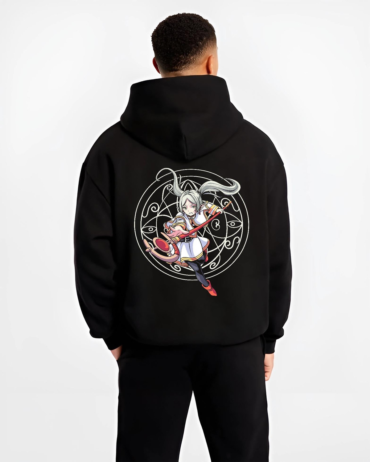Black hoodie on male model, back view, showing Noelle Silva Black Clover anime poster graphic with staff and magic circle.