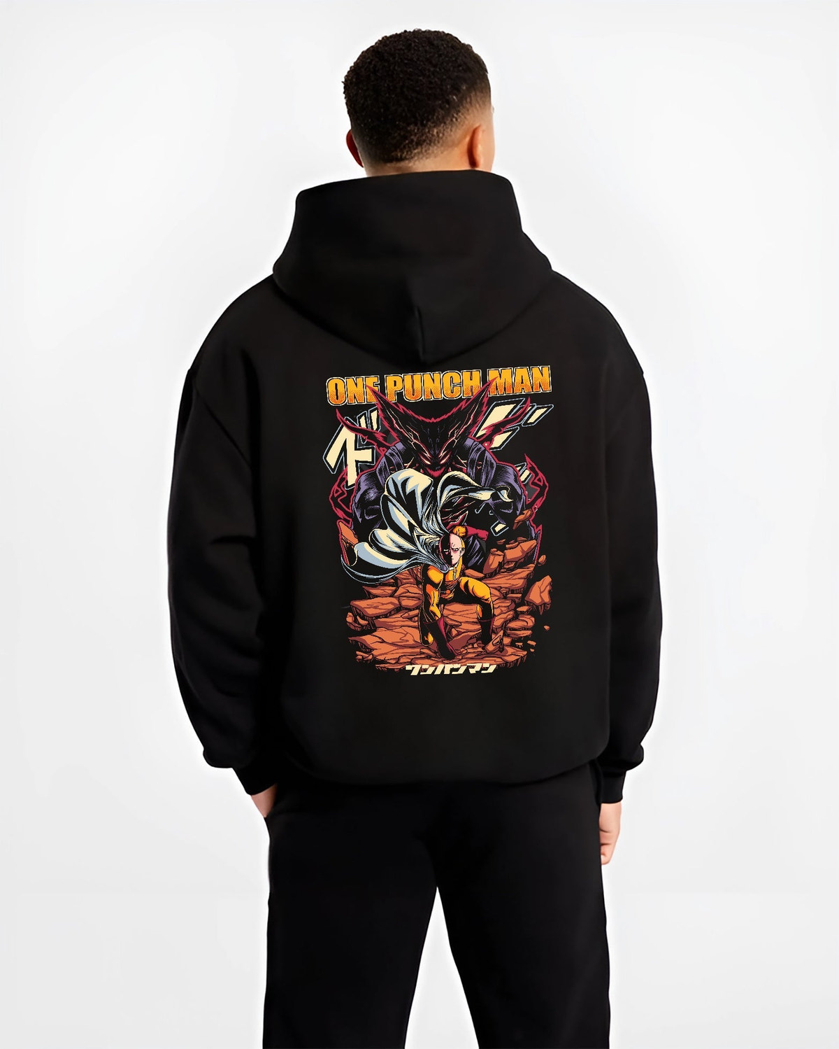 Black hoodie worn by a male model, back view, featuring One Punch Man retro manga inspired graphic with Saitama’s punch and Garou looming in Japanese animation style.