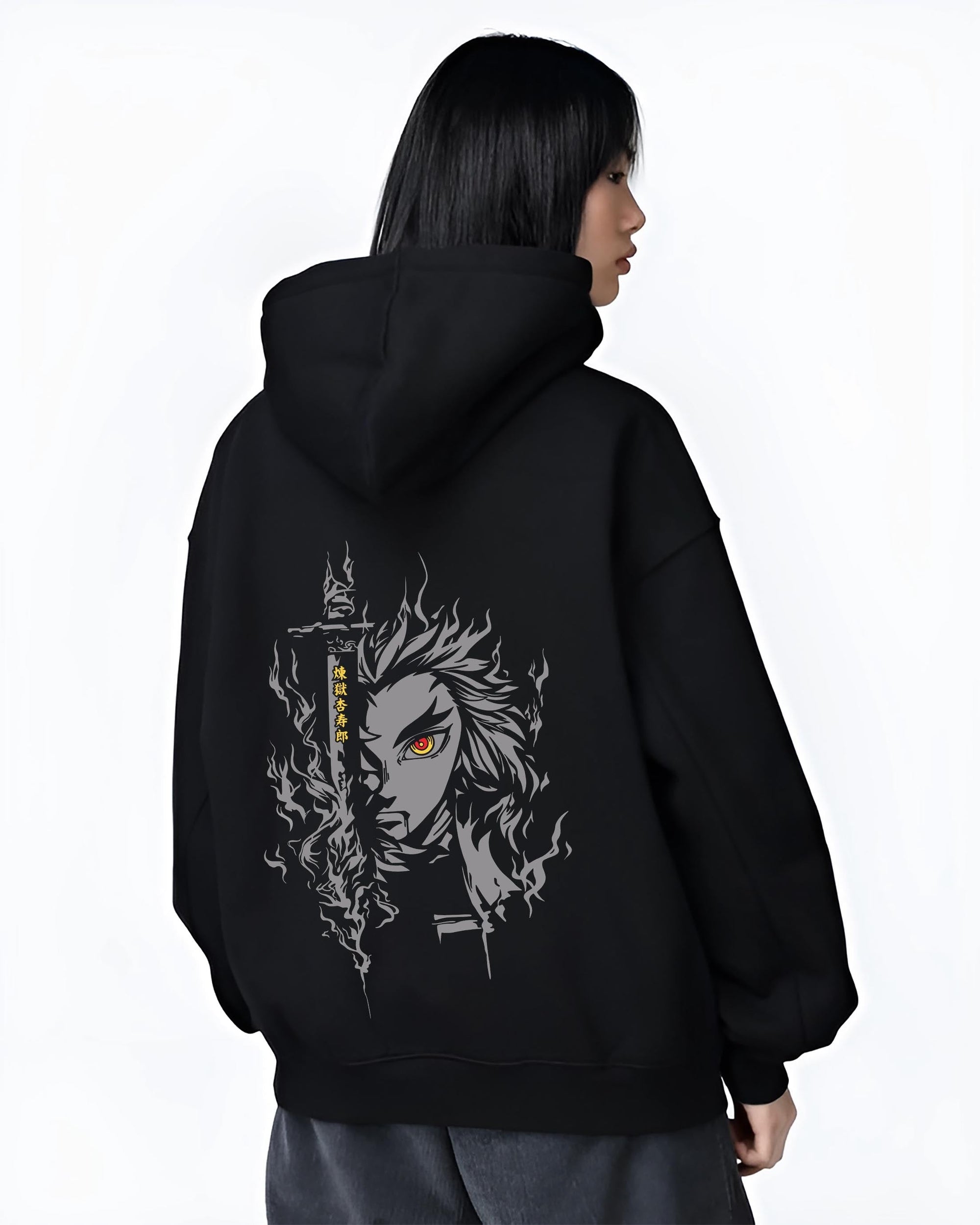 Black hoodie worn by a female model, back view, featuring Demon Slayer Rengoku retro manga graphic portrait with fiery aura and anime poster inspired battle design.