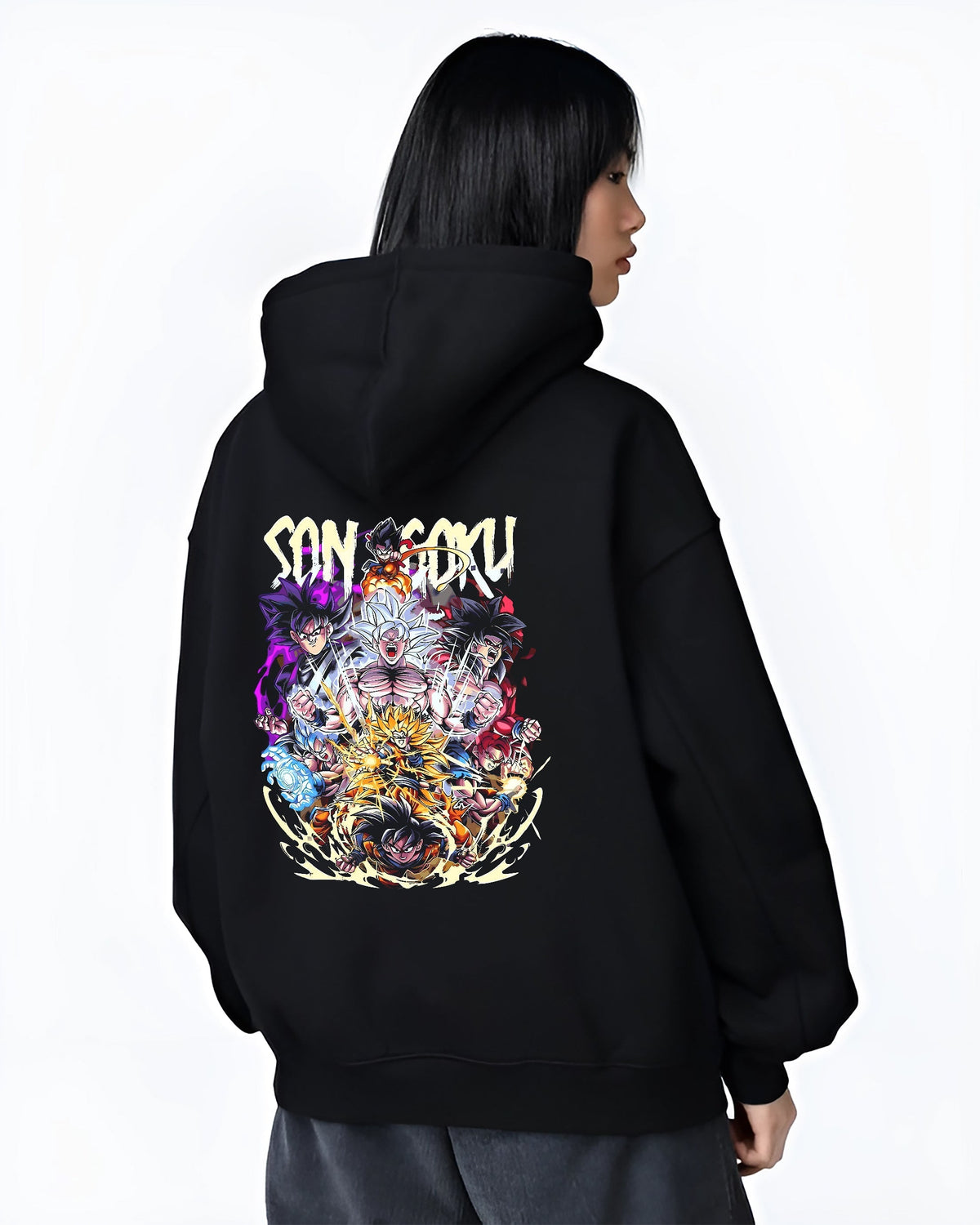 Black hoodie worn by a female model, back view, featuring Son Goku Dragon Ball retro manga graphic of Goku’s iconic forms in an urban fashion back design.