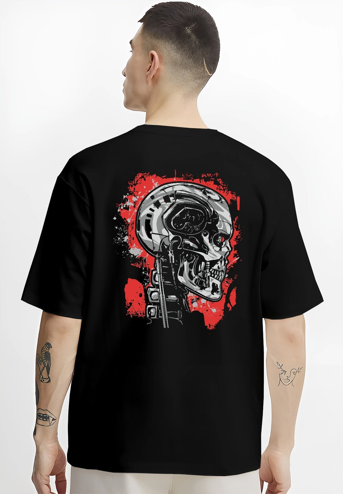 Black T-shirt on male model, back view, featuring Terminator T-800 mecha skull, bold retro sci-fi film graphic.