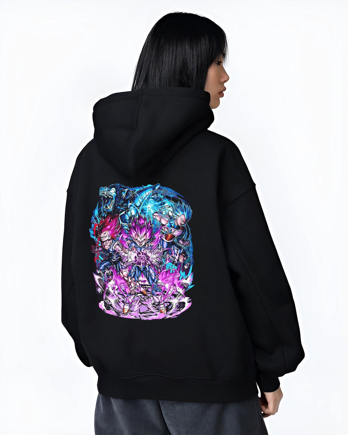 Black hoodie worn by a female model, back view, featuring Vegeta Dragon Ball anime poster inspired artwork with intense battle aura in an urban fashion back design.