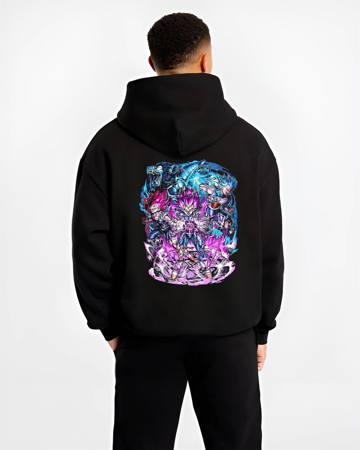 Black hoodie worn by a male model, back view, featuring Vegeta Dragon Ball retro manga graphic with energy-charged stance and Japanese animation streetwear detail.