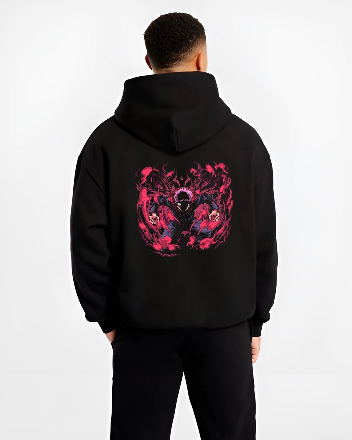 Black hoodie on male model, back view, Yuji Itadori anime poster graphic with swirling red cursed energy and shadow details.