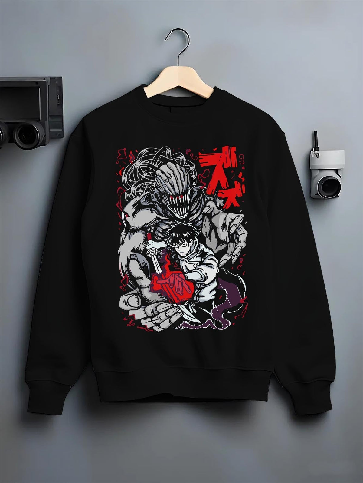 Black crewneck sweatshirt on hanger against grey wall, Yuta Okkotsu with Rika anime poster graphic, bold red and monochrome lines.